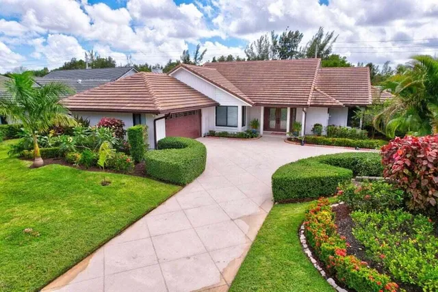 a view of a house with a garden