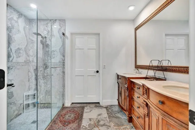 a bathroom with a sink and a mirror