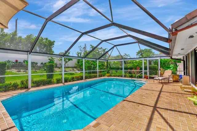 a view of a backyard with sitting area