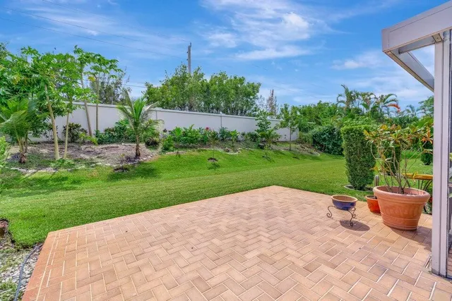 a view of a patio with a yard