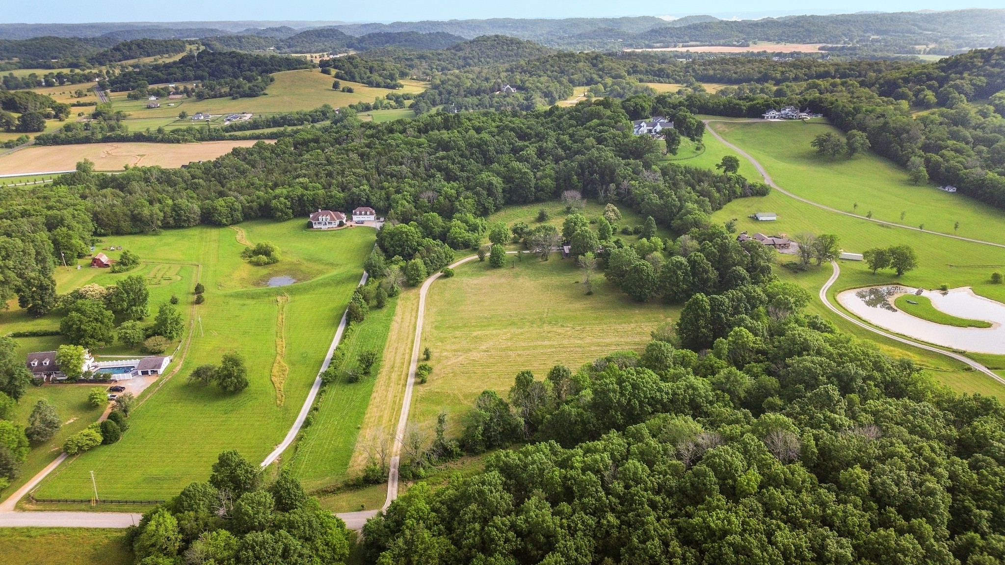 1896 West Harpeth Road Franklin, TN 37064 - Photo 1 of 24 an aerial view of a residential houses with outdoor space and trees