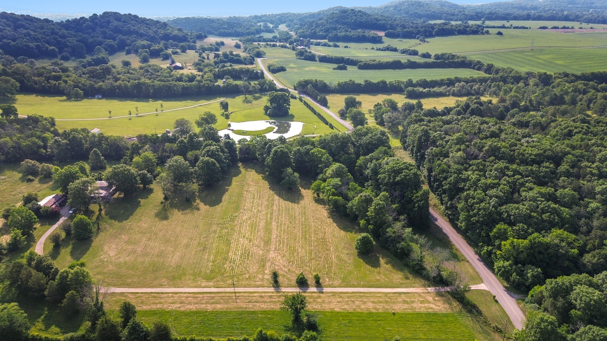 1896 West Harpeth Road Franklin, TN 37064 - Photo 11 of 24 an aerial view of residential houses with outdoor space and swimming pool