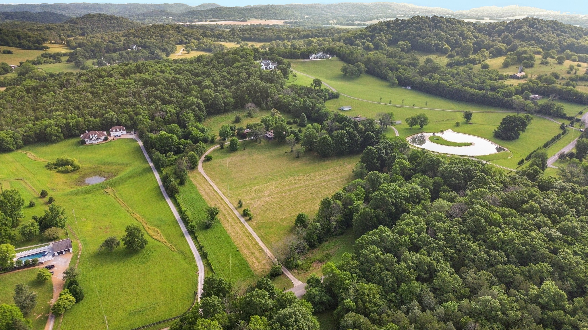 1896 West Harpeth Road Franklin, TN 37064 - Photo 3 of 24 an aerial view of residential houses with outdoor space