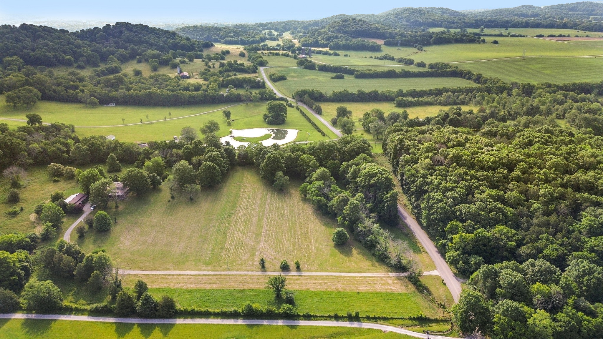 1896 West Harpeth Road Franklin, TN 37064 - Photo 4 of 24 a view of a lake with a mountain in the background
