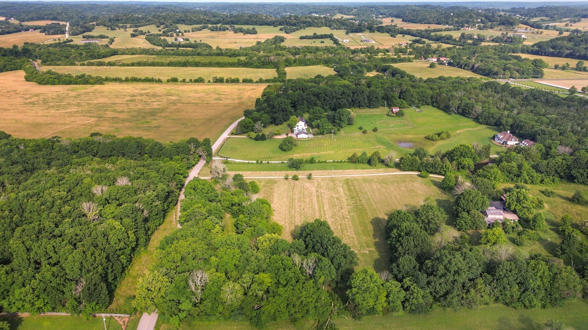 1896 West Harpeth Road Franklin, TN 37064 - Photo 8 of 24 a view of a lake from a yard