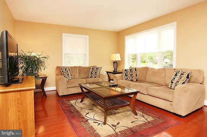 8100 Dalesford Road Baltimore, MD 21234 - Photo 14 of 17 a living room with furniture and a large window