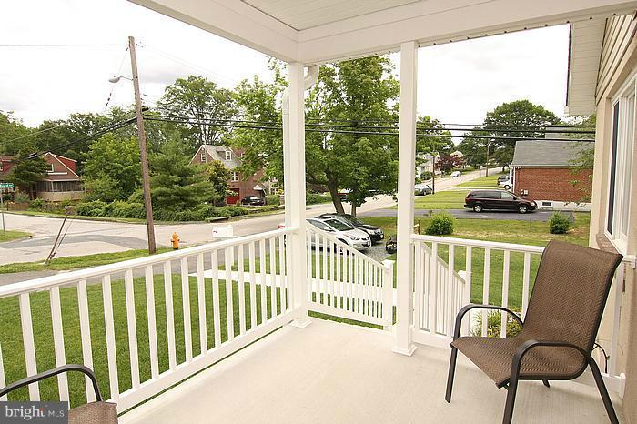 8100 Dalesford Road Baltimore, MD 21234 - Photo 8 of 17 a view of a chair and tables in the balcony