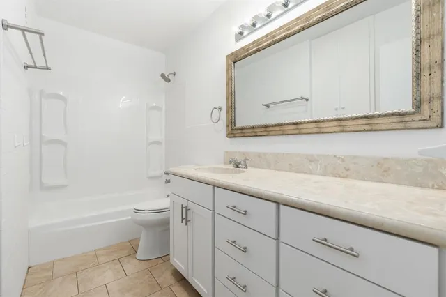 a bathroom with a sink a toilet and bathtub