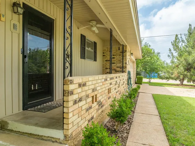 a view of a pathway both side of the house