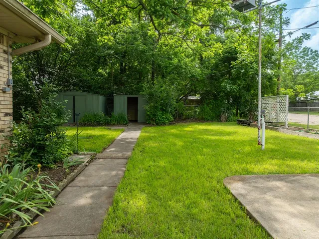 a view of a backyard with a small cabin