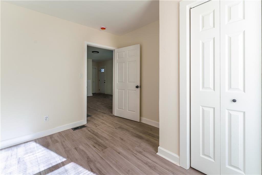 1365 Campbellton Road Southwest Atlanta, GA 30310 - Photo 11 of 36 a view of a hallway with wooden floor