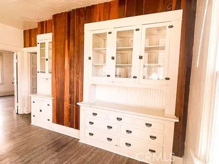 a view of wooden floor and windows in a room