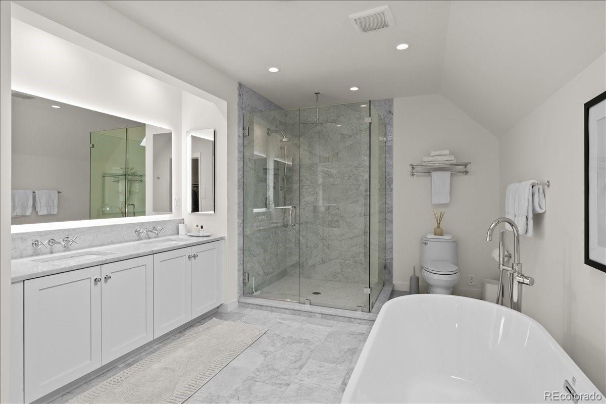 535 Garfield Street Denver, CO 80206 - Photo 32 of 50 a bathroom with a bathtub shower sink mirror and toilet
