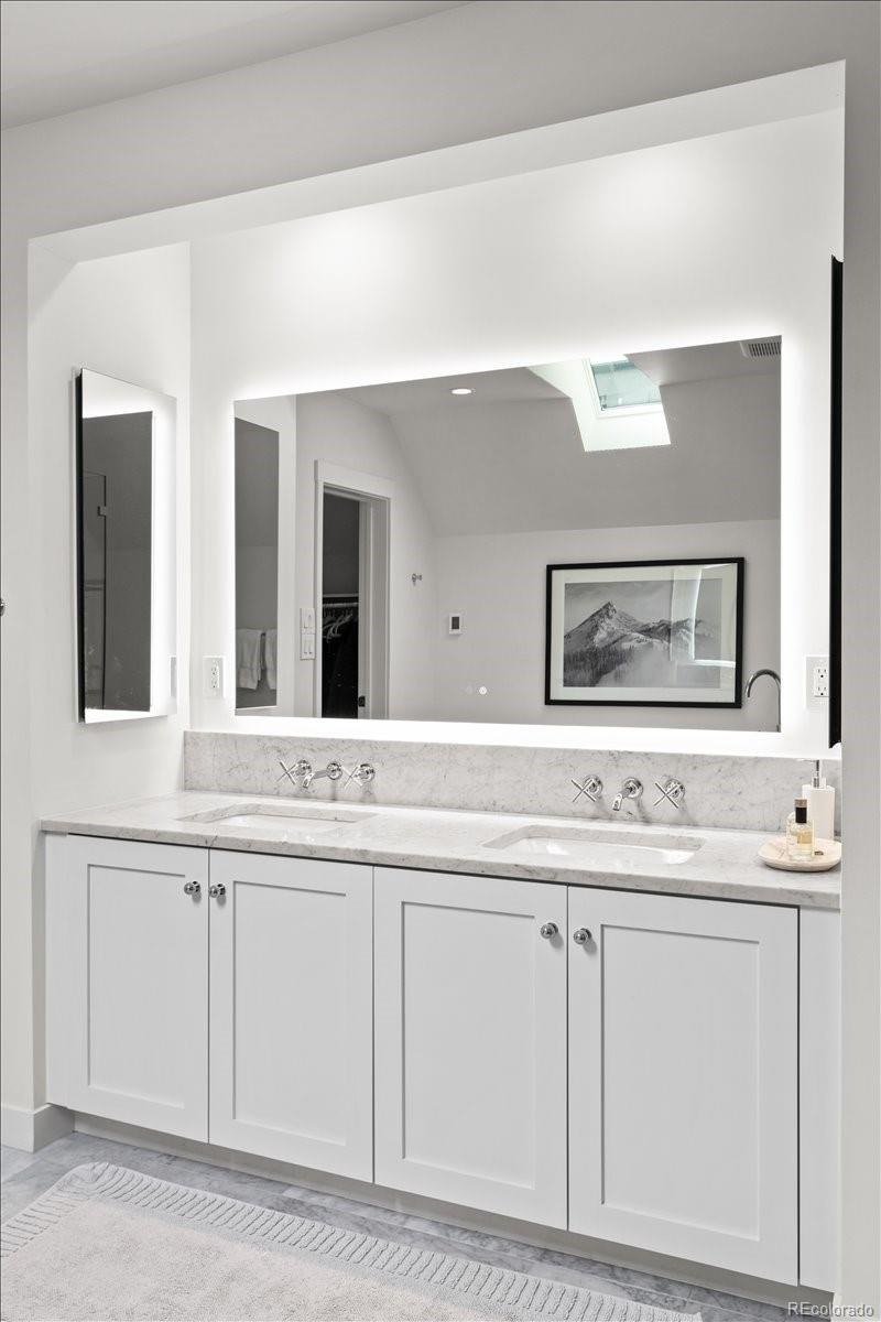 535 Garfield Street Denver, CO 80206 - Photo 33 of 50 a bathroom with cabinets and sink