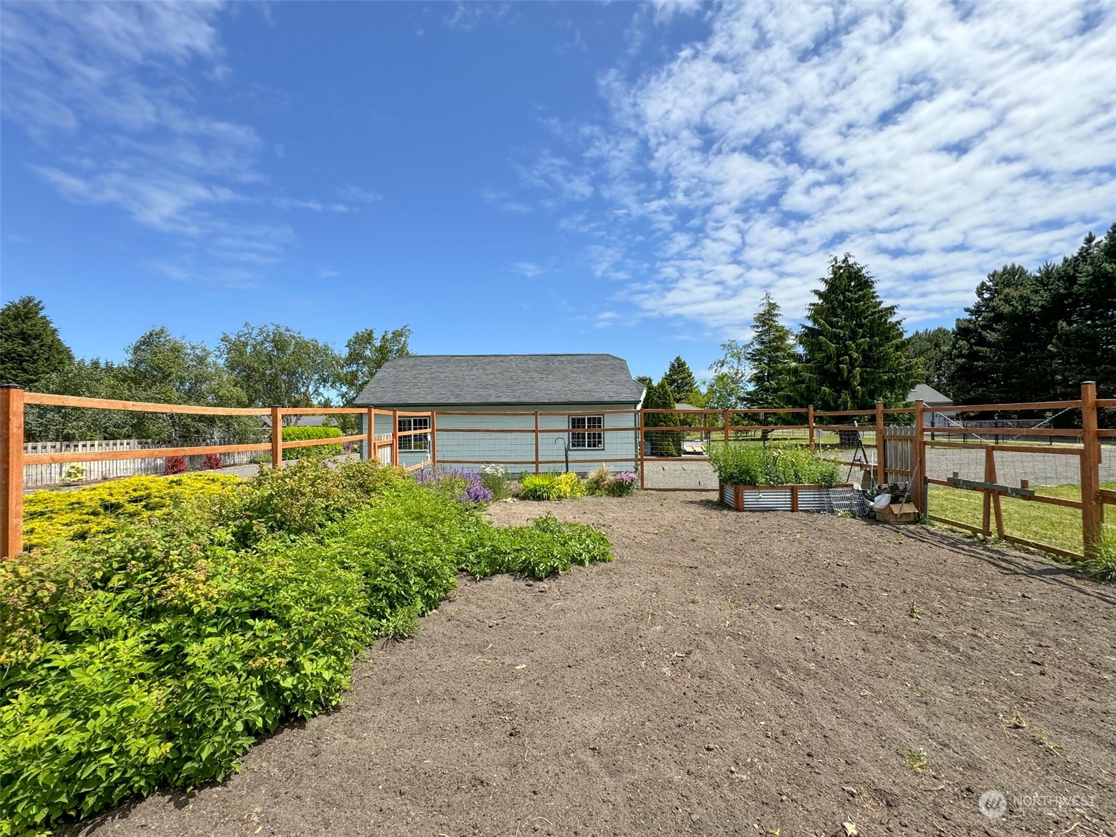 142 Kirner Road Sequim, WA 98382 - Photo 36 of 40 a view of a garden with an outdoor seating