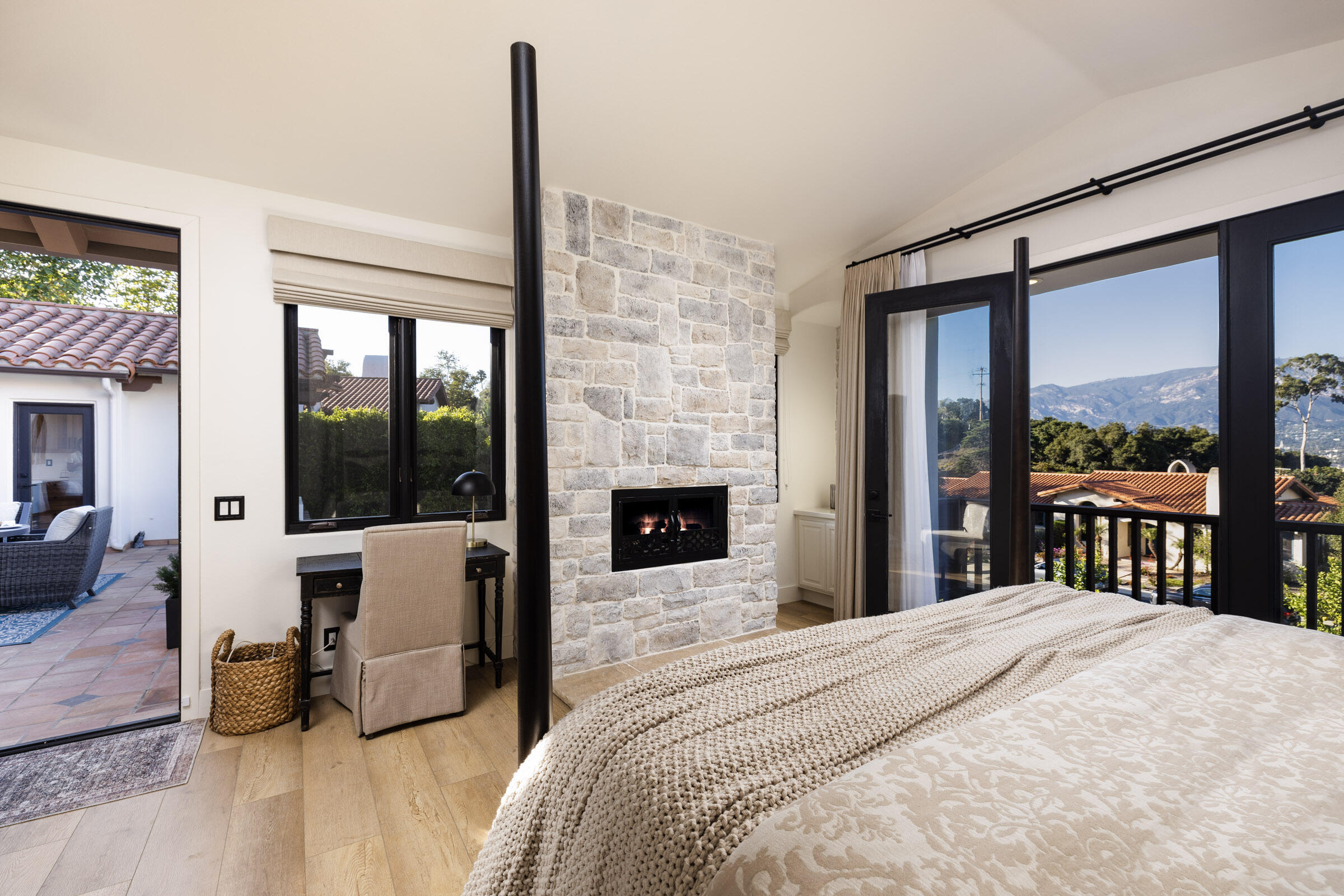 1215 Miracanon Lane Santa Barbara, CA 93109 - Photo 11 of 40 a bedroom with a large bed and a large window