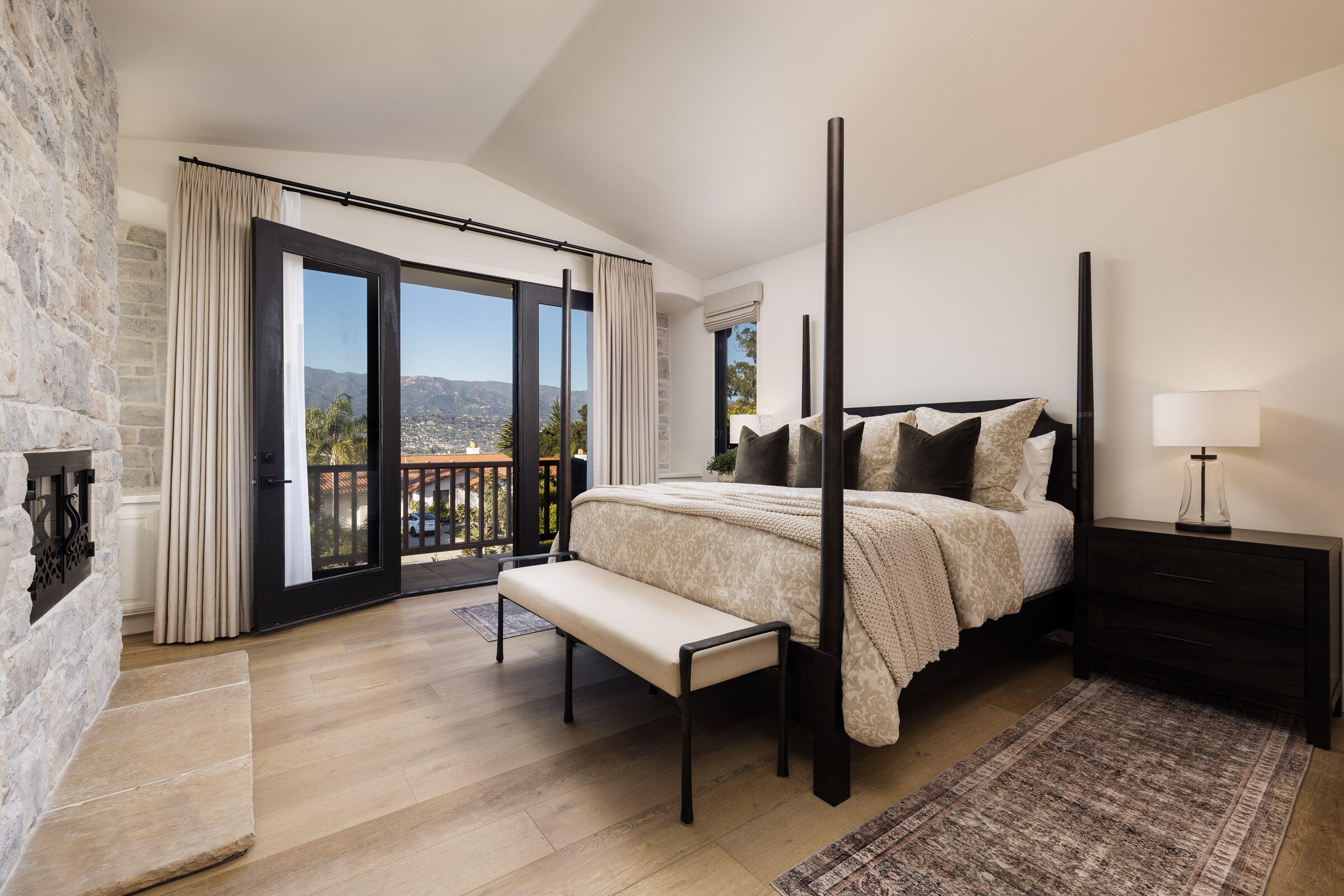 1215 Miracanon Lane Santa Barbara, CA 93109 - Photo 12 of 40 a bedroom with a bed and large window