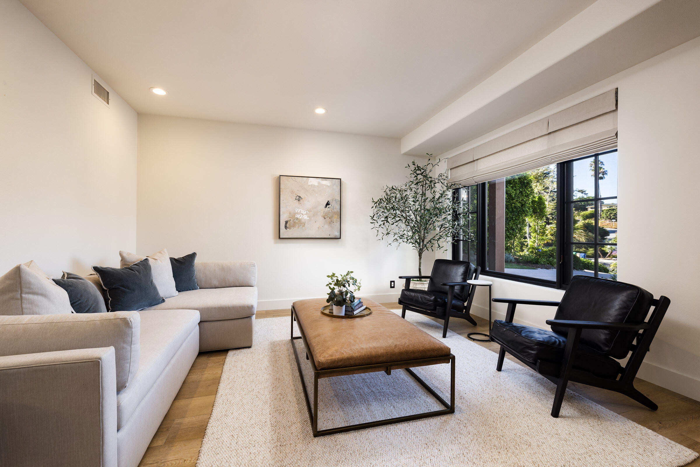1215 Miracanon Lane Santa Barbara, CA 93109 - Photo 23 of 40 a living room with furniture and a large window