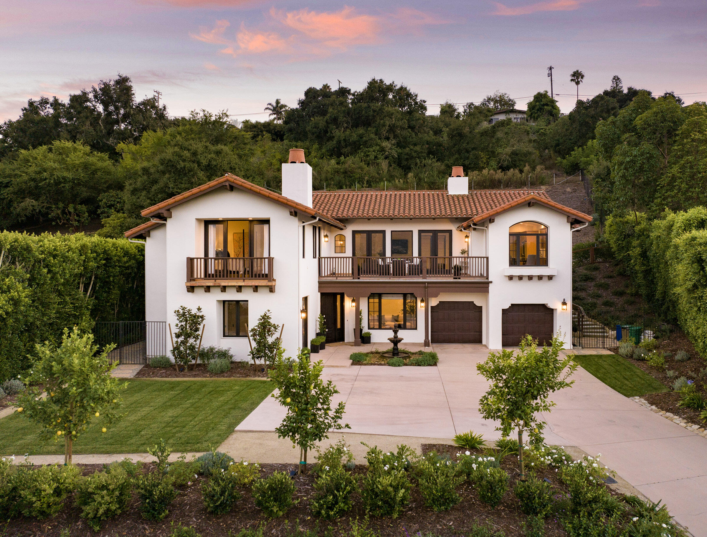 1215 Miracanon Lane Santa Barbara, CA 93109 - Photo 3 of 40 a front view of a house with a yard