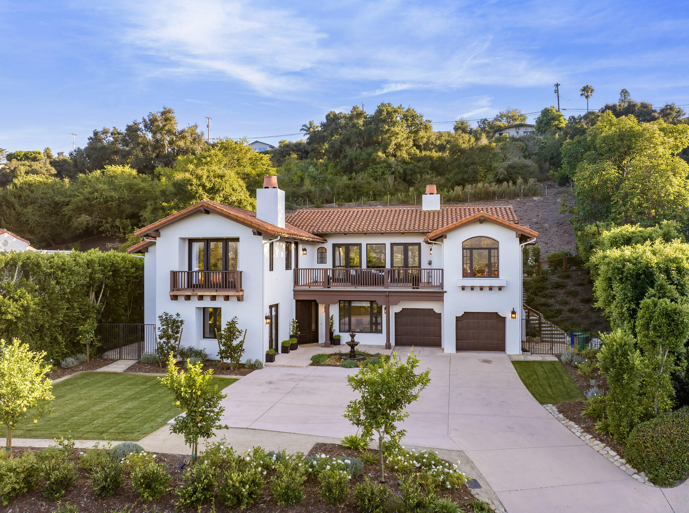 1215 Miracanon Lane Santa Barbara, CA 93109 - Photo 37 of 40 a front view of a house with yard and green space
