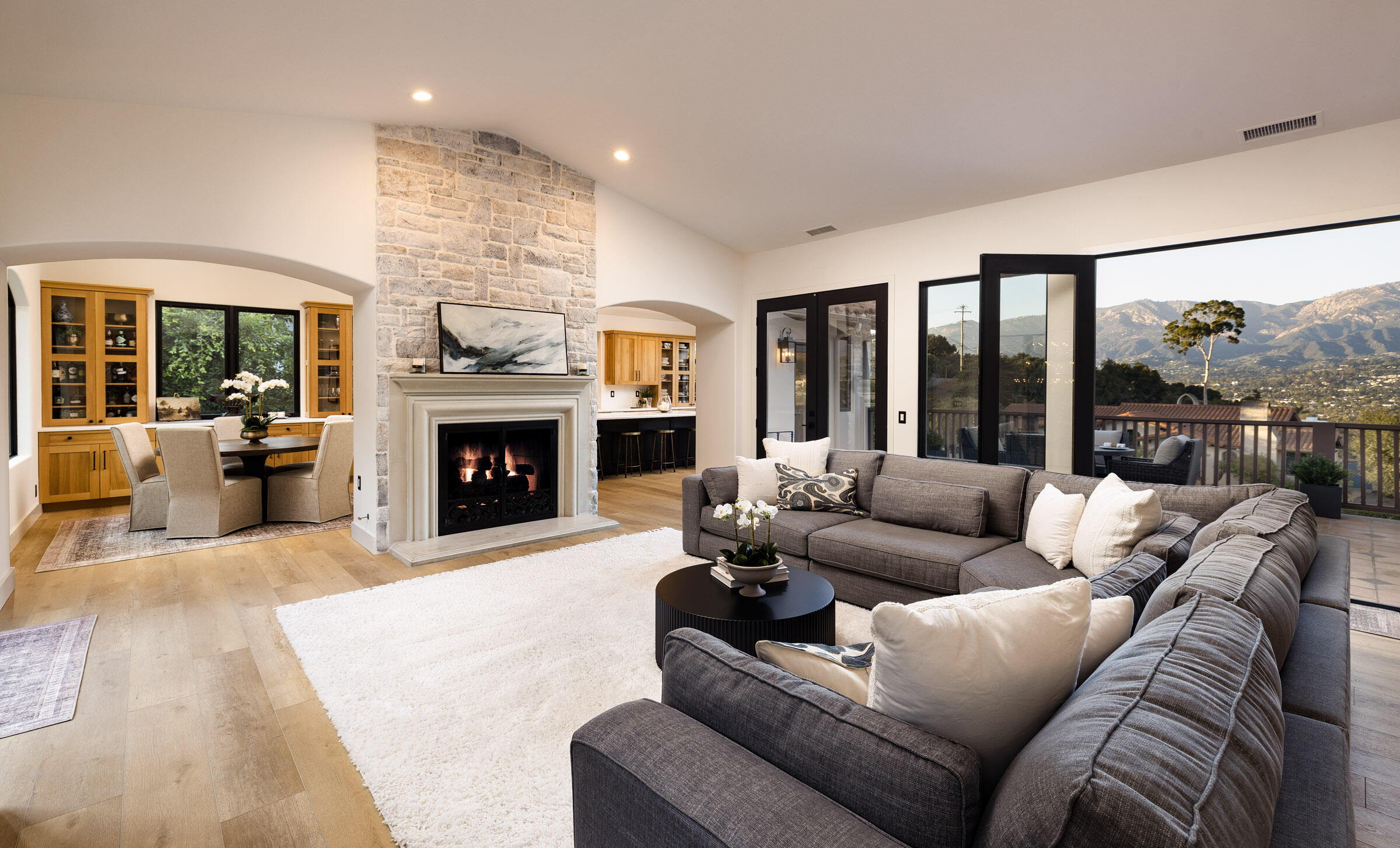 1215 Miracanon Lane Santa Barbara, CA 93109 - Photo 4 of 40 a living room with furniture and a fireplace
