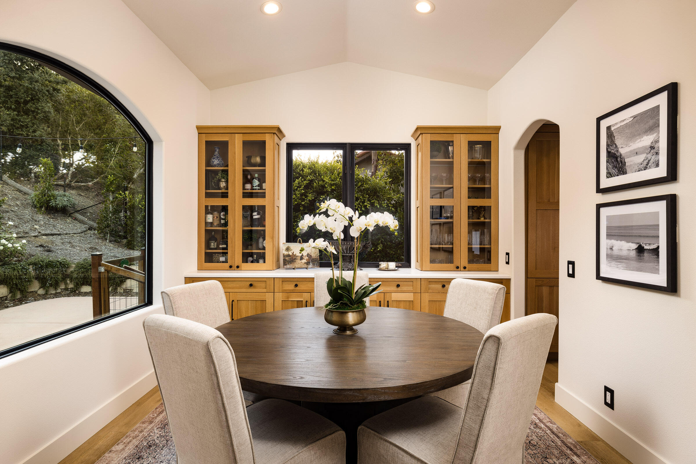 1215 Miracanon Lane Santa Barbara, CA 93109 - Photo 10 of 40 a dining room with furniture wooden floor and a floor to ceiling window
