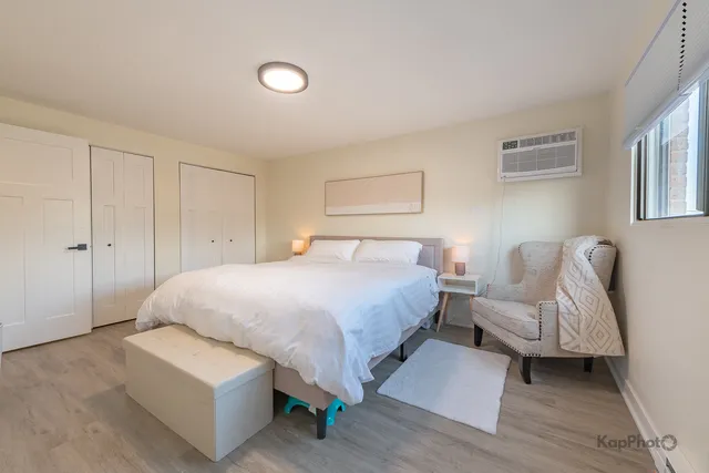 a bedroom with a bed and a couch