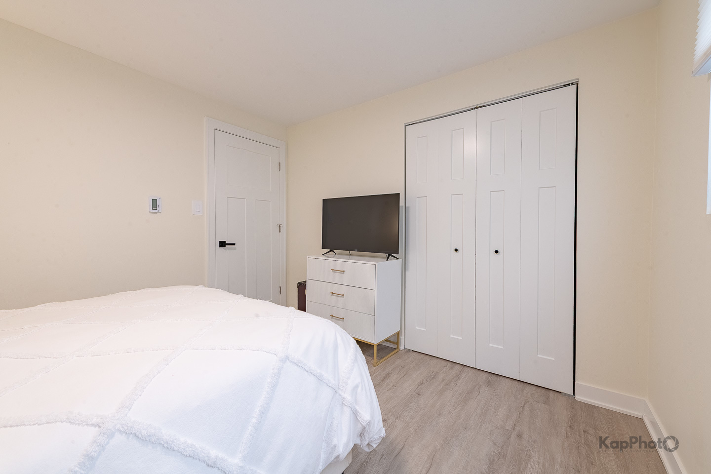 6612 West 64th Place, Unit 2W Chicago, IL 60638 - Photo 21 of 28 a bedroom with a bed and a flat screen tv