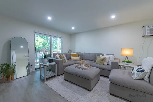a living room with furniture and a lamp