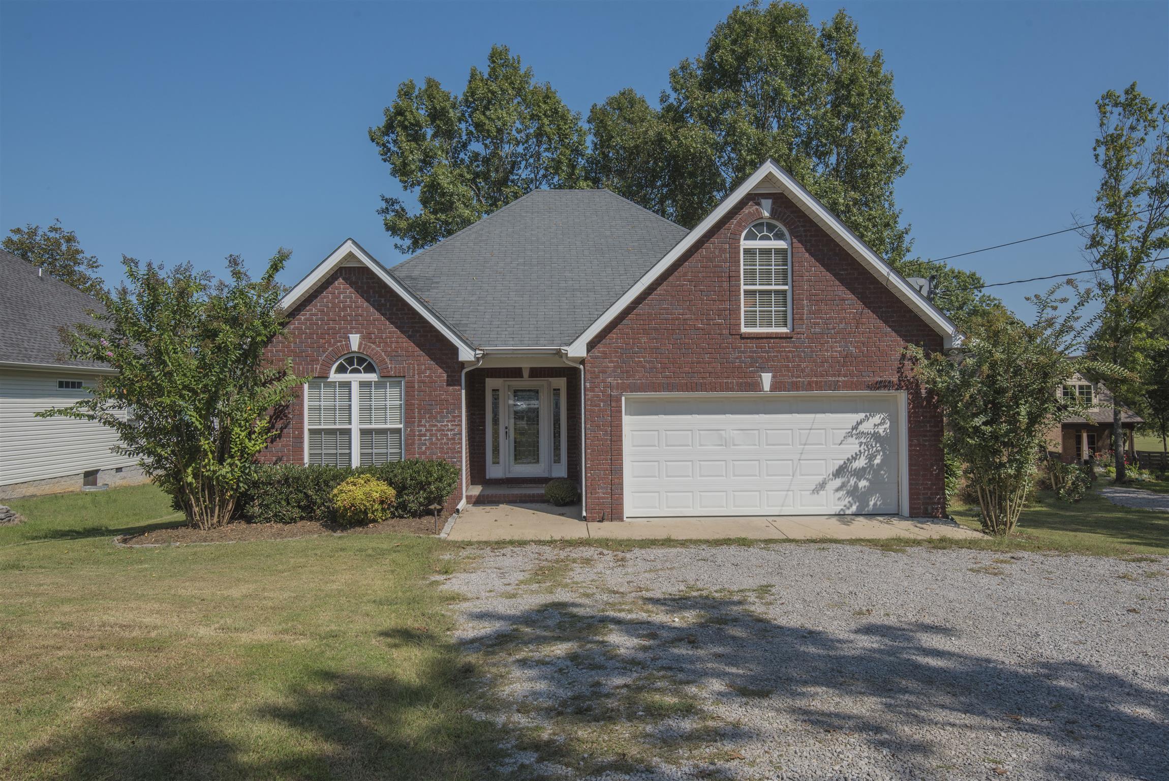 14904 Mt Pleasant Road Rockvale, TN 37153 - Photo 1 of 23 a front view of a house with a yard and garage