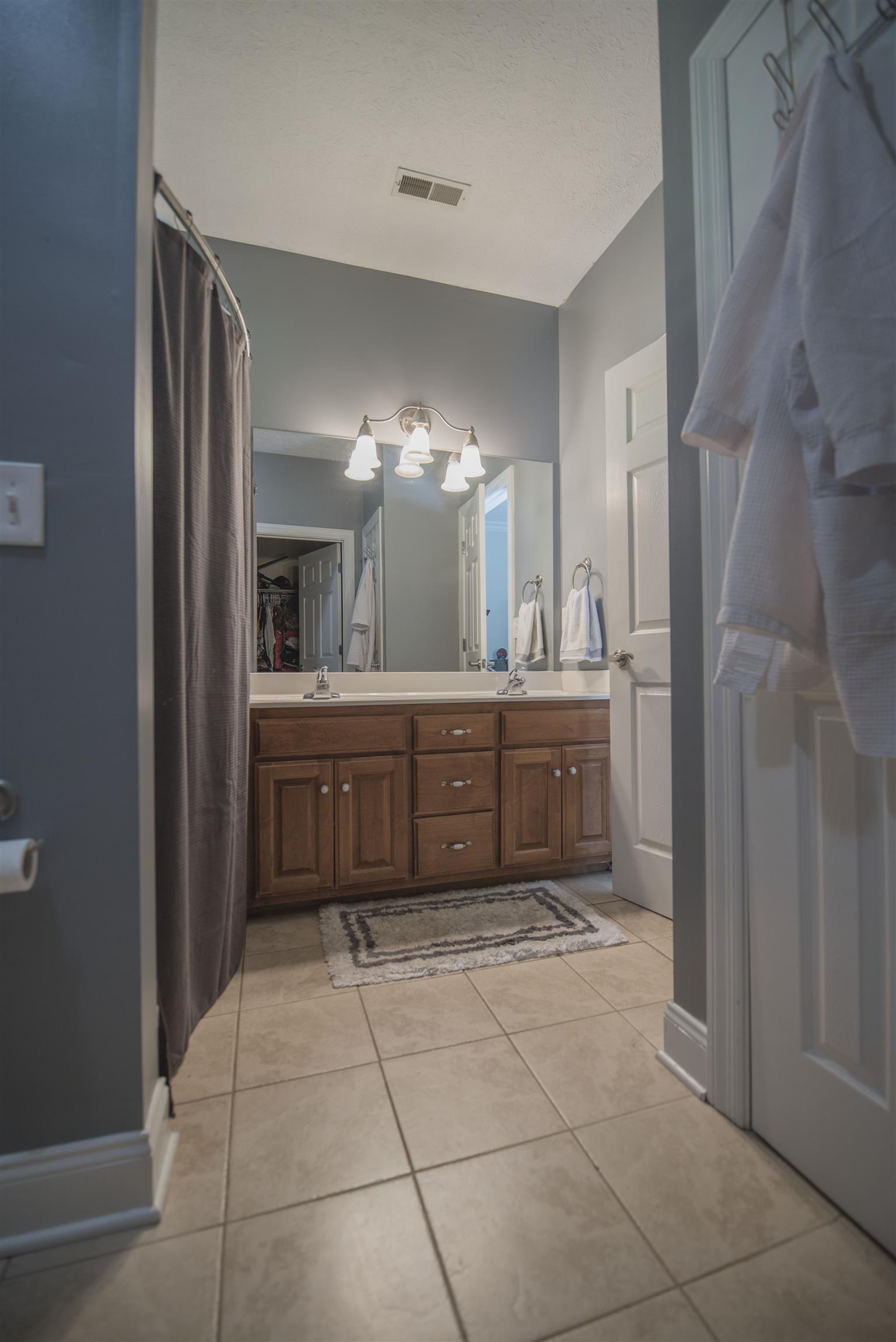 14904 Mt Pleasant Road Rockvale, TN 37153 - Photo 11 of 23 a bathroom with a sink a vanity and a mirror