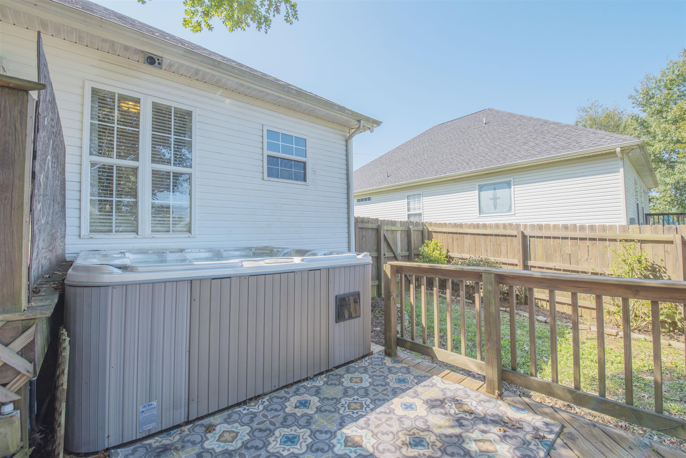 14904 Mt Pleasant Road Rockvale, TN 37153 - Photo 19 of 23 a view of a house with a wooden deck and a yard