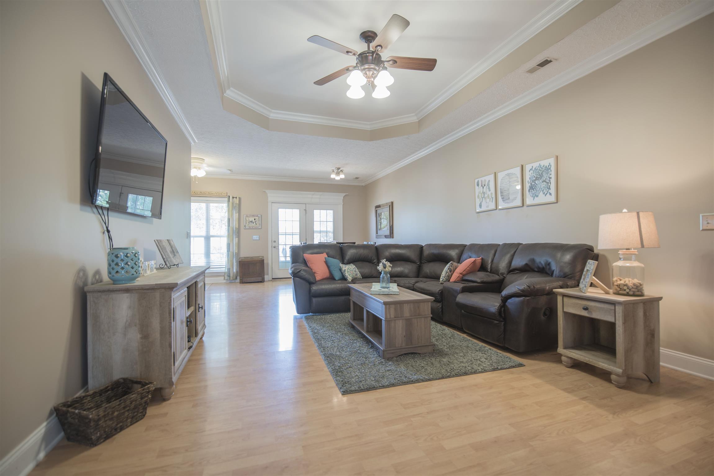 14904 Mt Pleasant Road Rockvale, TN 37153 - Photo 3 of 23 a living room with furniture a flat screen tv and kitchen view