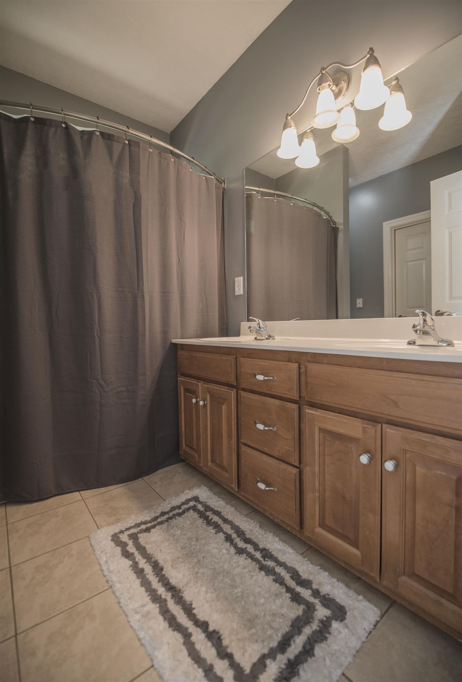 14904 Mt Pleasant Road Rockvale, TN 37153 - Photo 10 of 23 a spacious bathroom with a double vanity sink and a mirror