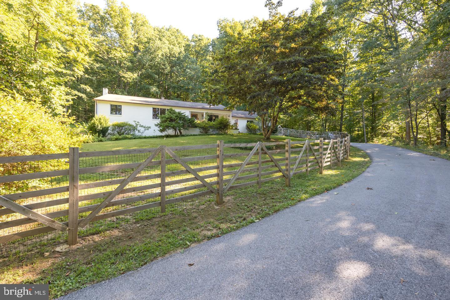 1256 Hollow Road Chester Springs, PA 19425 - Photo 72 of 79 Driveway with fencing leading to 2 car garage