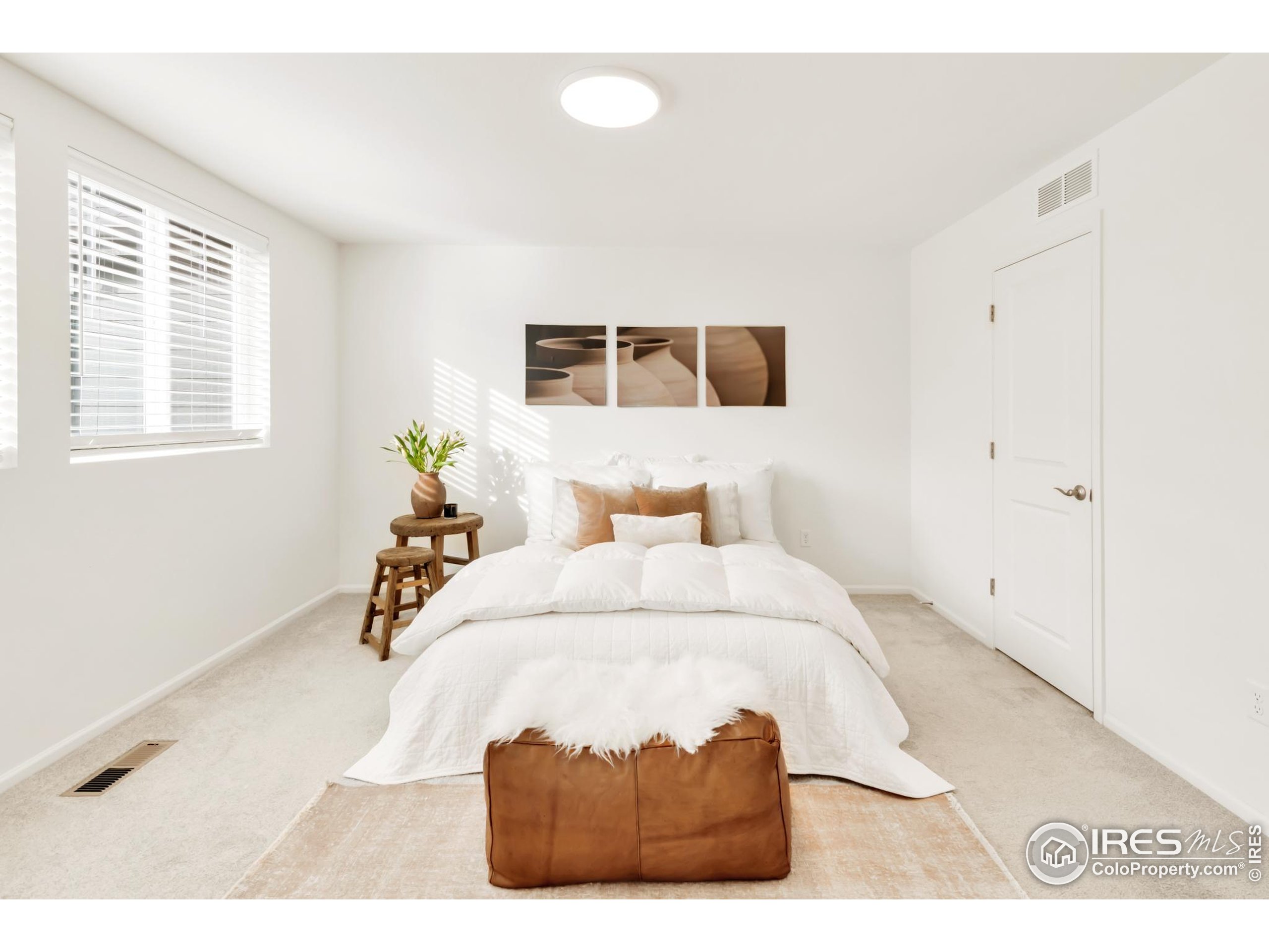 2455 Alpine Street Longmont, CO 80504 - Photo 17 of 30 a bedroom with a bed and a window
