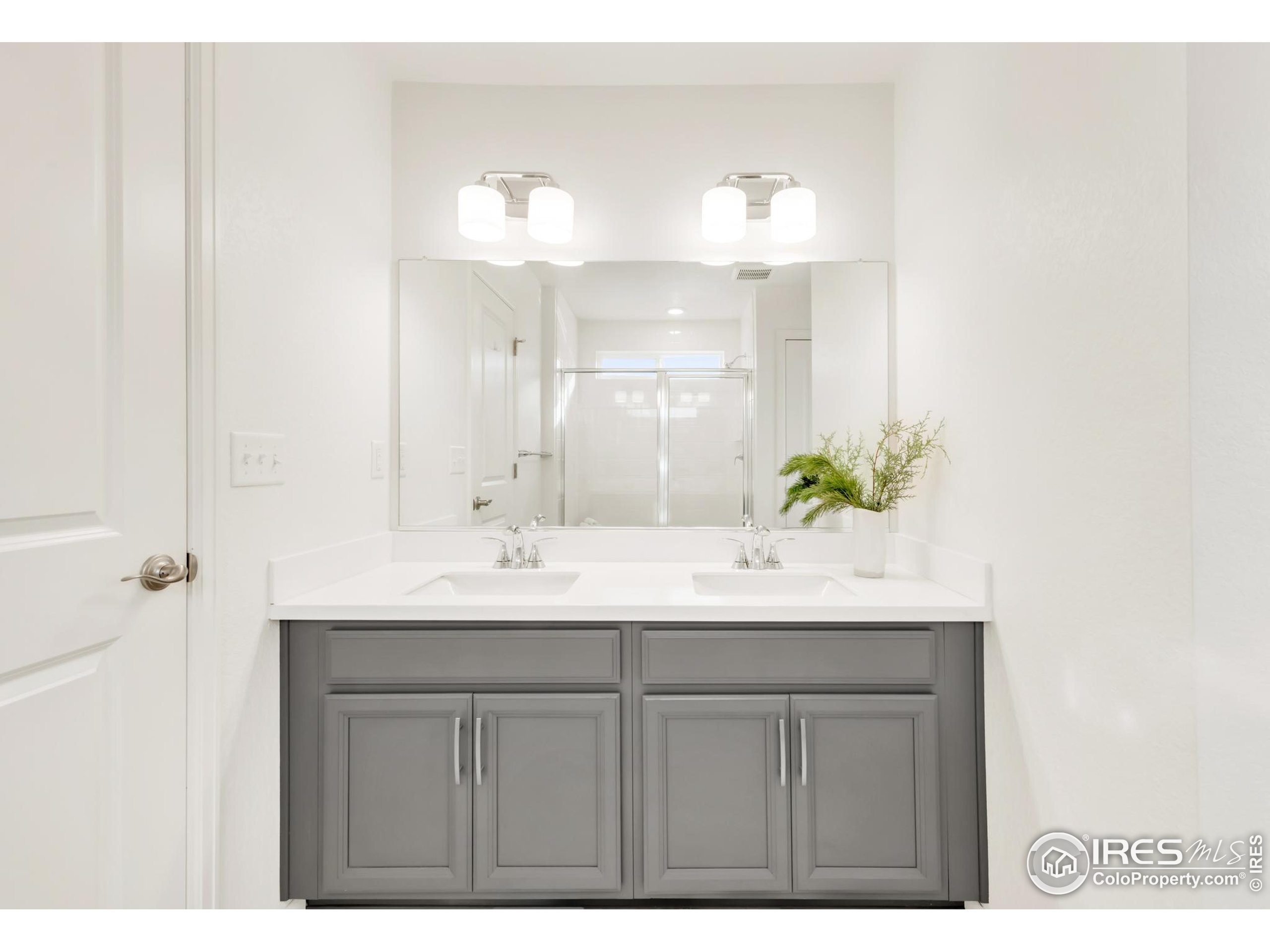 2455 Alpine Street Longmont, CO 80504 - Photo 20 of 30 a bathroom with a sink and a mirror
