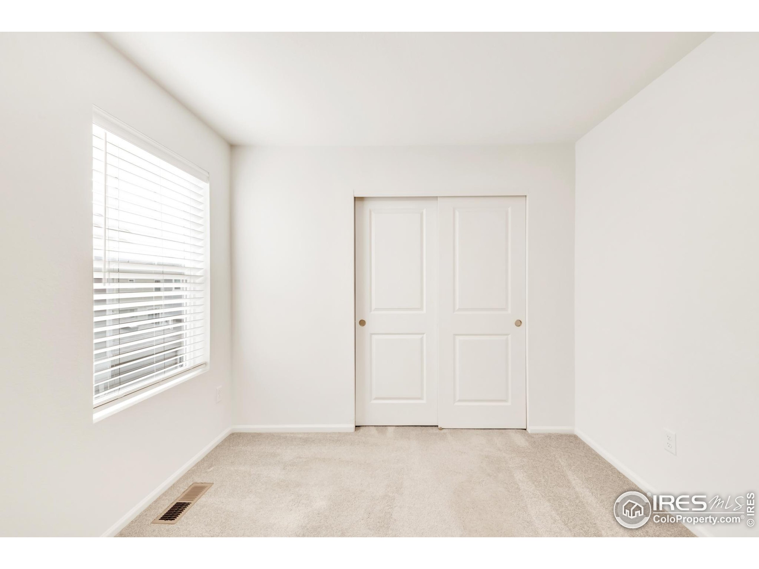 2455 Alpine Street Longmont, CO 80504 - Photo 26 of 30 a view of an empty room with a window