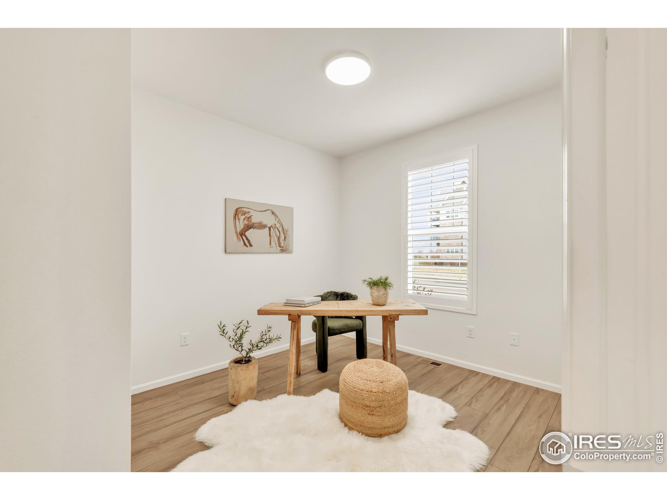 2455 Alpine Street Longmont, CO 80504 - Photo 4 of 30 a living room with furniture and window