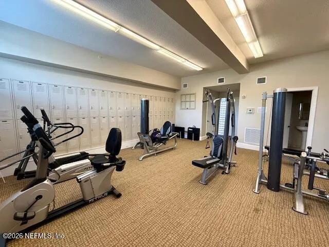 a front view of a building with parking space