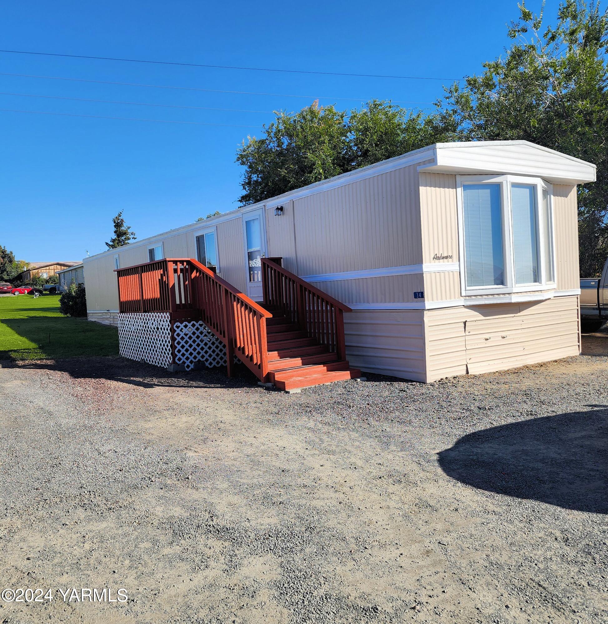 181 Schut Road, Unit 34 Moxee, WA 98936 - Photo 3 of 18 a view of a house with a yard
