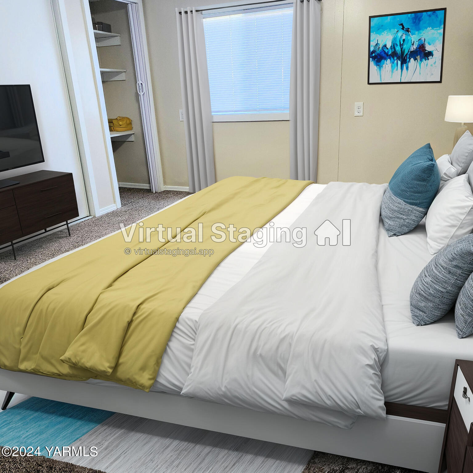 181 Schut Road, Unit 34 Moxee, WA 98936 - Photo 10 of 18 a bedroom with a bed and a flat screen tv