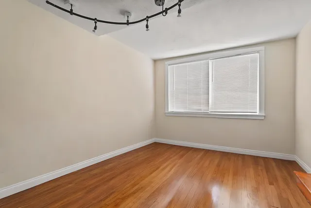 a kitchen with a refrigerator and a sink