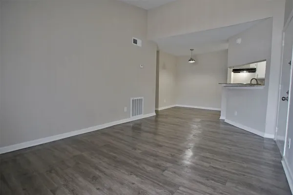 a open kitchen with a refrigerator and dishwasher