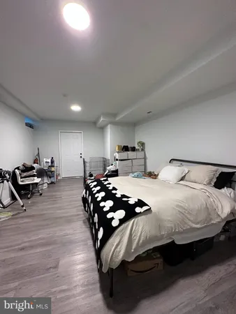 a bedroom with bed and window