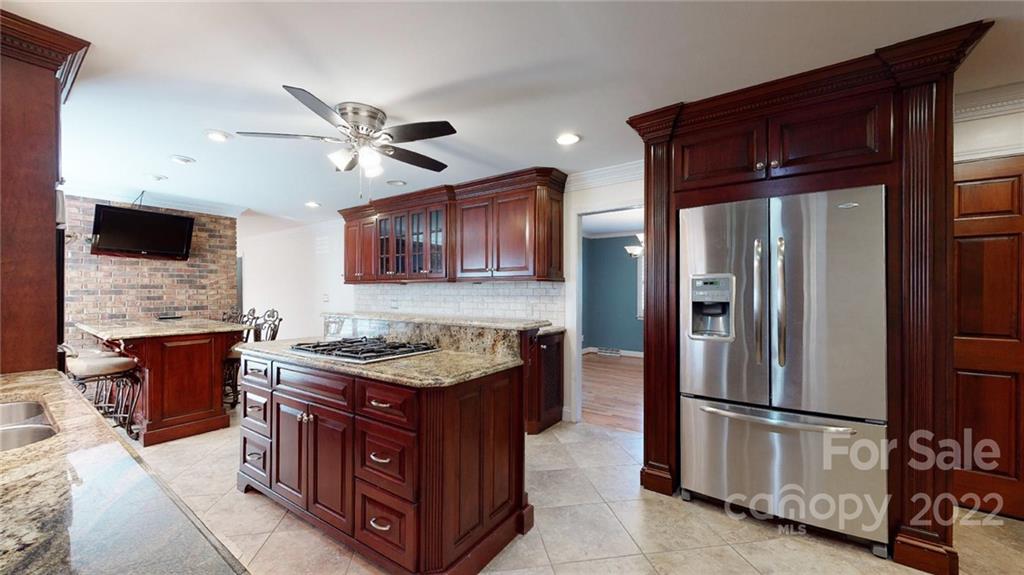 118 Patrick Road Gastonia, NC 28056 - Photo 13 of 45 a kitchen with stainless steel appliances granite countertop a refrigerator a stove a sink and a microwave