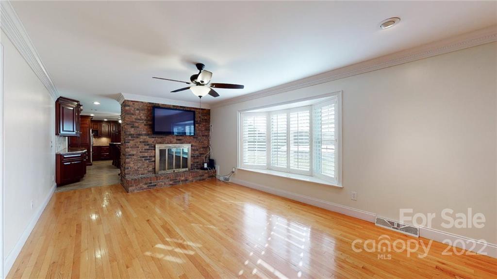 118 Patrick Road Gastonia, NC 28056 - Photo 19 of 45 a big room with chandelier fan and windows