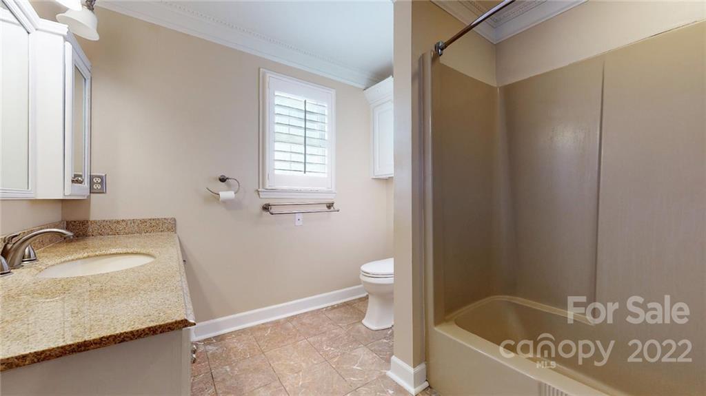 118 Patrick Road Gastonia, NC 28056 - Photo 28 of 45 a bath room with a sink and a toilet
