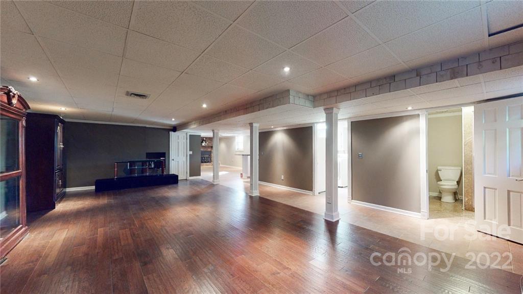 118 Patrick Road Gastonia, NC 28056 - Photo 34 of 45 a view of a big room with wooden floors