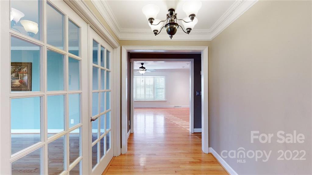 118 Patrick Road Gastonia, NC 28056 - Photo 6 of 45 a view of a hallway with wooden floor and entryway